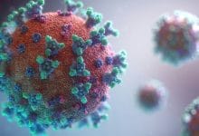 una molecola di virus di colore nero e blu chiaro insieme ad altre molecole più piccole